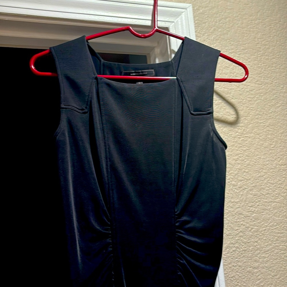 BCBG black dress with ruching on both sides front & back.